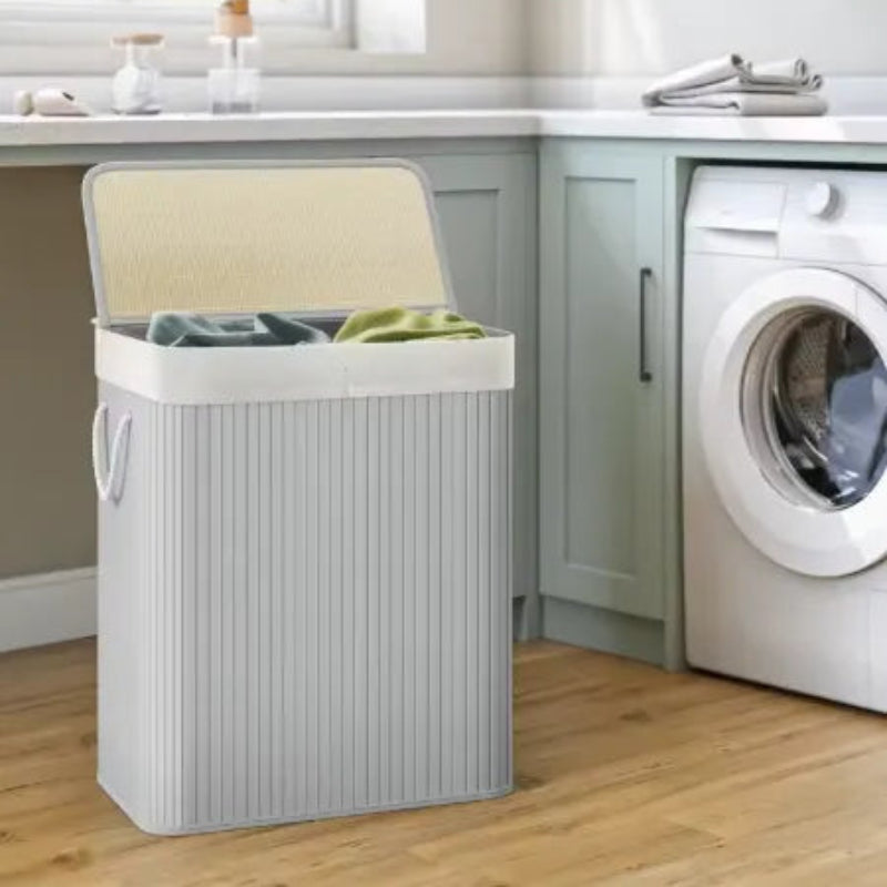 Panier à linge double gris a coter d'une machine a laver 