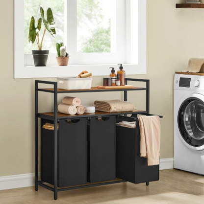 Panier à linge 3 compartiments a double étagère à coté d'une machine à laver 