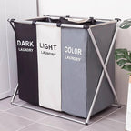 Panier à linge 3 compartiments pliable de couleurs dans une salle de bain 
