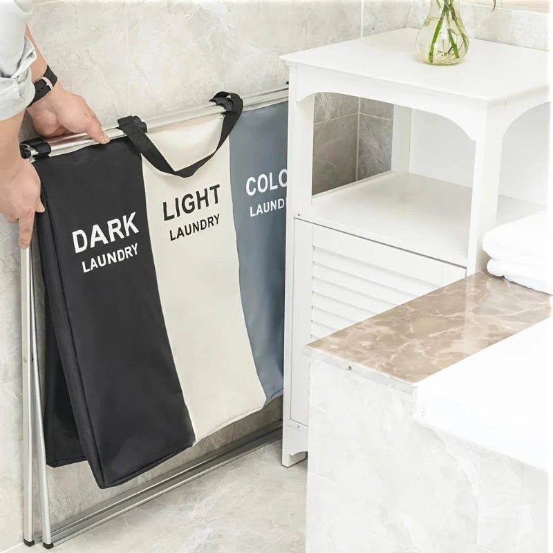 Panier à linge 3 compartiments pliable plier dans un petit coin de la salle de bain 